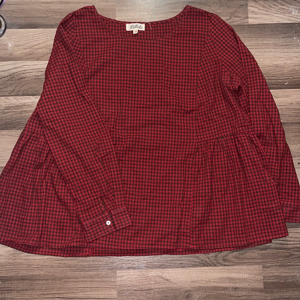 Listicle top with pleated sides in red plaid
